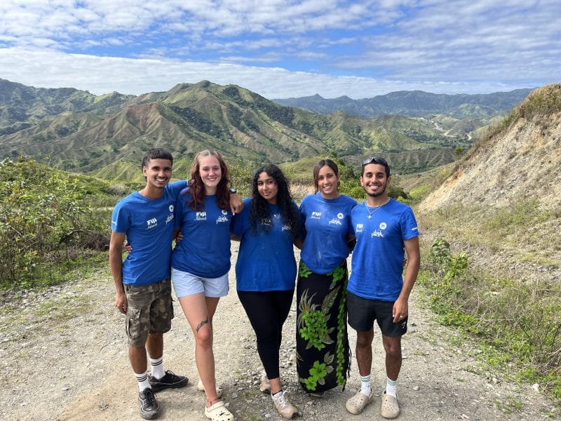 group of friends with mountain view behind