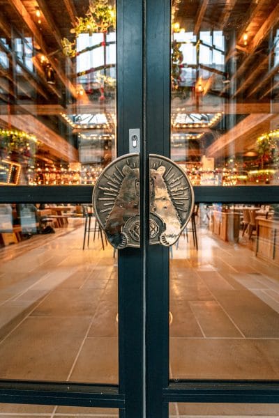 restaurant front door with gold bear handle