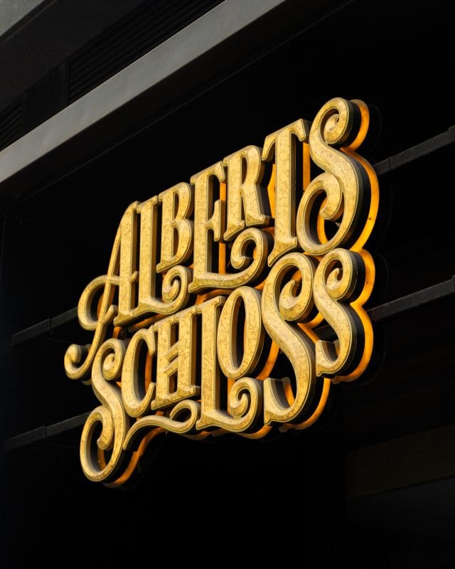 gold letters alberts schloss sign