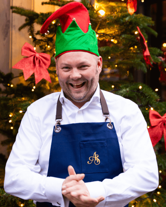 Christmas elves hat and tree at the back