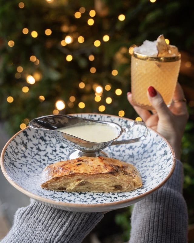 plate with christmas menu pastry and gravy and cocktails